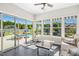 Cozy sunroom with tile flooring, large sliding doors, and natural light overlooking the pool area at 17 Kaki Ct, Selma, NC 27576