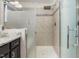 Bathroom showcasing a walk-in shower with glass enclosure and decorative tile at 1701 Bodwin Ln, Apex, NC 27502