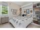 Bedroom with built-in shelving and murphy bed at 1701 Bodwin Ln, Apex, NC 27502