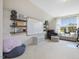 Versatile bonus room features a comfortable seating area, whiteboard, and natural light, ideal for relaxation and productivity at 1701 Bodwin Ln, Apex, NC 27502
