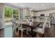 Bright dining area with access to the kitchen and an outside patio at 1701 Bodwin Ln, Apex, NC 27502