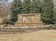Attractive entrance sign of Salem Village surrounded by greenery and beautiful flowers at 1701 Bodwin Ln, Apex, NC 27502