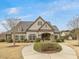 Charming home with well-manicured lawn, landscaping, and a curved walkway leading to the front entrance at 1701 Bodwin Ln, Apex, NC 27502