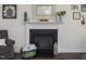 Living room fireplace with mantle and decor at 1701 Bodwin Ln, Apex, NC 27502