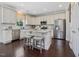 Beautiful, bright kitchen featuring an island, stainless steel appliances, and ample counter space at 1701 Bodwin Ln, Apex, NC 27502