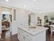 Bright kitchen island with granite countertops and stainless steel hardware at 1701 Bodwin Ln, Apex, NC 27502