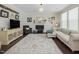 Bright living room with hardwood floors and a fireplace at 1701 Bodwin Ln, Apex, NC 27502