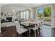 Dining area adjacent to an open concept living room with access to outdoor patio at 1701 Bodwin Ln, Apex, NC 27502