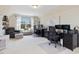 Bright home office featuring dual workstations, and comfortable seating, designed for productivity and comfort at 1701 Bodwin Ln, Apex, NC 27502