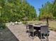 Outdoor patio with a fire pit and seating areas is perfect for relaxation and outdoor enjoyment at 1701 Bodwin Ln, Apex, NC 27502