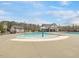 Community pool featuring a splash area, ample lounging space and nearby bath house at 1701 Bodwin Ln, Apex, NC 27502