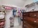 Spacious walk-in closet offers ample storage with shelving and a dresser, making organization effortless and accessible at 1701 Bodwin Ln, Apex, NC 27502