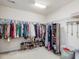 Organized walk-in closet offers ample storage for clothing and shoes, maximizing space and convenience at 1701 Bodwin Ln, Apex, NC 27502