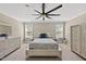 Bedroom features a bed, wardrobe, dresser, and a ceiling fan at 178 Ashpole Trl, Clayton, NC 27520