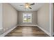 Vacant bedroom filled with natural light, featuring a ceiling fan and hardwood floors at 178 Ashpole Trl, Clayton, NC 27520