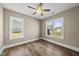 Bright, empty bedroom with hardwood floors and lots of natural light at 178 Ashpole Trl, Clayton, NC 27520