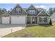 Beautiful two-story home with a spacious driveway and manicured front lawn at 178 Ashpole Trl, Clayton, NC 27520