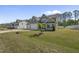 Craftsman-style home with a two-car garage and a neatly landscaped yard at 178 Ashpole Trl, Clayton, NC 27520