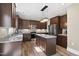 Kitchen with island, stainless steel appliances and dark cabinets at 178 Ashpole Trl, Clayton, NC 27520