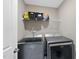 Laundry room featuring a Maytag washer and dryer and wire rack shelving at 178 Ashpole Trl, Clayton, NC 27520