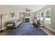 Living room with fireplace, large ceiling fan, two sofas and blue rug at 178 Ashpole Trl, Clayton, NC 27520