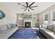 Well-lit living room with comfortable seating and a cozy fireplace at 178 Ashpole Trl, Clayton, NC 27520