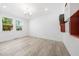 Bright bedroom with hardwood floors, white walls, natural light, and unique shelving at 1813 Lost Creek Ct, Apex, NC 27539