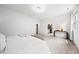 Bright, spacious bedroom featuring modern lighting and an en-suite bathroom, perfect for relaxation and privacy at 1813 Lost Creek Ct, Apex, NC 27539