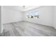 A bright room with three large windows overlooking houses in the neighborhood at 1813 Lost Creek Ct, Apex, NC 27539