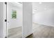 Bedroom entrance featuring light-colored flooring and a bright window view at 1813 Lost Creek Ct, Apex, NC 27539