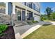 Charming front porch with stone pillars and a dark front door at 1813 Lost Creek Ct, Apex, NC 27539