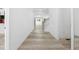 Bright hallway with hardwood floors leading to an open floor plan at 1813 Lost Creek Ct, Apex, NC 27539