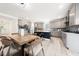 Spacious kitchen with gray cabinets, stainless appliances, and central island at 1813 Lost Creek Ct, Apex, NC 27539