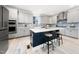 A spacious kitchen island featuring modern countertops and seating, perfect for casual dining and entertaining guests at 1813 Lost Creek Ct, Apex, NC 27539