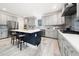 Modern kitchen with stainless steel appliances, spacious countertops, and a stylish backsplash, perfect for cooking and entertaining at 1813 Lost Creek Ct, Apex, NC 27539