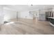 Expansive living space with a fireplace, hardwood floors, and an open floor plan to the kitchen at 1813 Lost Creek Ct, Apex, NC 27539