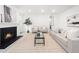 Cozy living area with fireplace, soft lighting, and comfortable seating at 1813 Lost Creek Ct, Apex, NC 27539