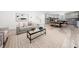 Open concept living room and kitchen featuring sleek design and ample space at 1813 Lost Creek Ct, Apex, NC 27539