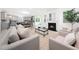 Bright, open concept living space with a fireplace and modern kitchen at 1813 Lost Creek Ct, Apex, NC 27539