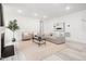 Bright living room with modern furnishings, fireplace, and recessed lighting at 1813 Lost Creek Ct, Apex, NC 27539