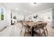 Bright and spacious living space with modern wood floors and a fireplace at 1813 Lost Creek Ct, Apex, NC 27539