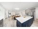 Open living concept connecting kitchen, dining, and living areas for seamless entertaining at 1813 Lost Creek Ct, Apex, NC 27539