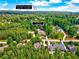 Aerial view of 187 Stoney Creek Wy, a neighborhood surrounded by lush green trees, and the Preserve at Jordan Lake at 187 Stoney Creek Way, Chapel Hill, NC 27517