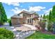 Large backyard with patio, basketball hoop, stone fence with a pergola, and lush landscaping at 187 Stoney Creek Way, Chapel Hill, NC 27517