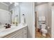 Cozy bathroom features a white vanity, framed mirror and shower-tub combination at 187 Stoney Creek Way, Chapel Hill, NC 27517