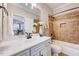 Bathroom features a vanity, framed mirror, and shower-tub combination at 187 Stoney Creek Way, Chapel Hill, NC 27517