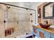 Beautiful bathroom featuring a tiled shower with a glass door and a unique vanity with a vessel sink at 187 Stoney Creek Way, Chapel Hill, NC 27517