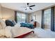 Bedroom with a large window, soft carpet, accent furniture, and a ceiling fan at 187 Stoney Creek Way, Chapel Hill, NC 27517