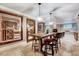 Dining area with wine storage, a fireplace and stone flooring at 187 Stoney Creek Way, Chapel Hill, NC 27517