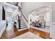 Entryway with staircase and dining area with decorative chandelier and hardwood flooring at 187 Stoney Creek Way, Chapel Hill, NC 27517